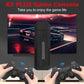 Game console with two controllers in front of a screen displaying a car racing game.